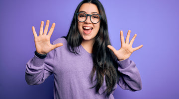 Woman holding up ten fingers for ten things about CBD oil